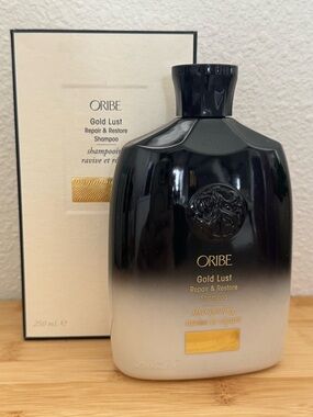 Oribe Gold Lust Repair & Restore Shampoo — Cream and Black Box with Gold Accent